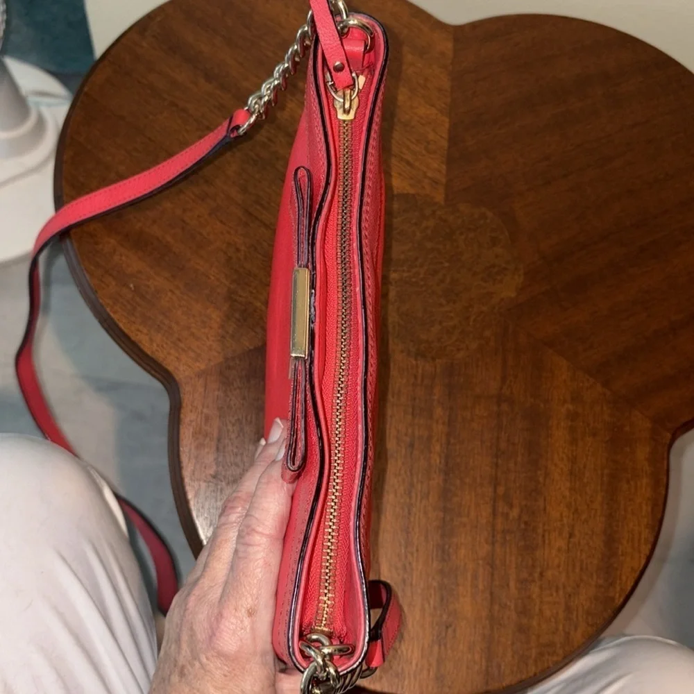 Kate Spade   Crossbody bag  leather orangeish red   bow on front chain strap det